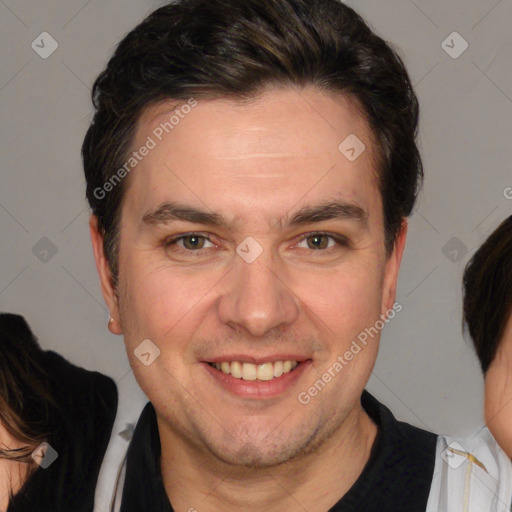 Joyful white adult male with short  brown hair and brown eyes