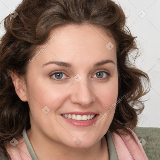 Joyful white young-adult female with medium  brown hair and blue eyes