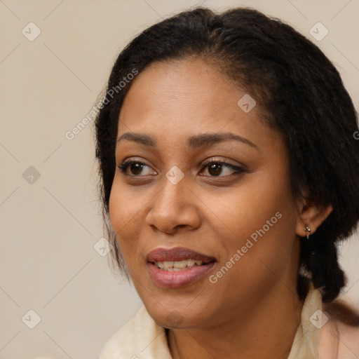 Joyful black young-adult female with medium  brown hair and brown eyes