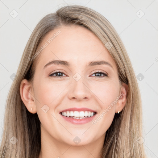 Joyful white young-adult female with long  brown hair and grey eyes