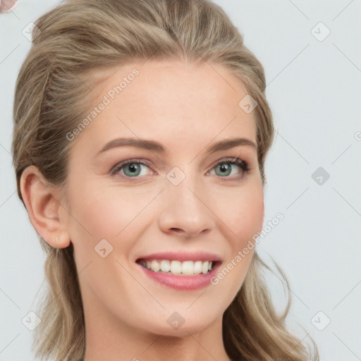 Joyful white young-adult female with long  brown hair and blue eyes