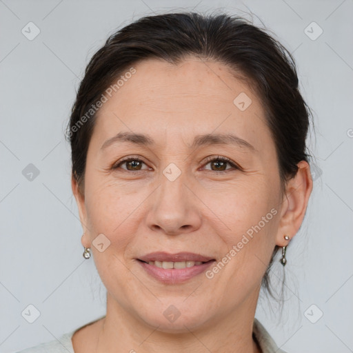 Joyful white adult female with medium  brown hair and brown eyes