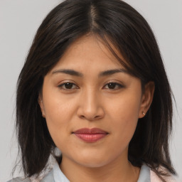 Joyful asian young-adult female with medium  brown hair and brown eyes