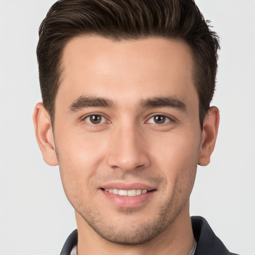 Joyful white young-adult male with short  brown hair and brown eyes