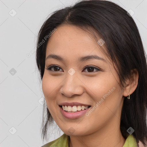 Joyful white young-adult female with long  brown hair and brown eyes