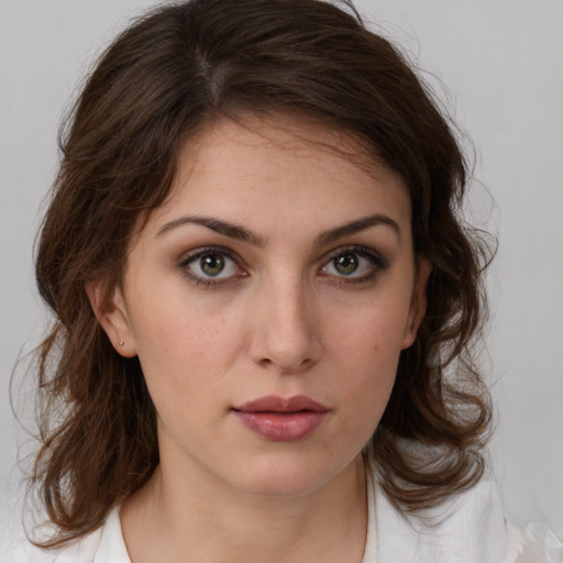 Neutral white young-adult female with medium  brown hair and brown eyes