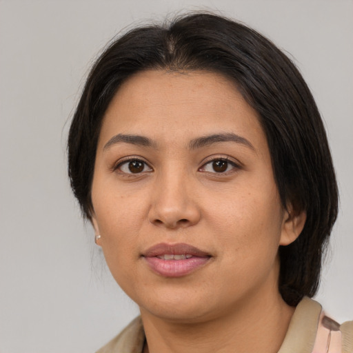 Joyful asian young-adult female with medium  brown hair and brown eyes