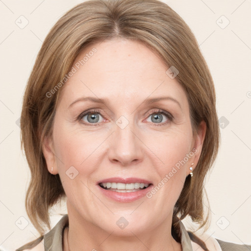 Joyful white adult female with medium  brown hair and grey eyes