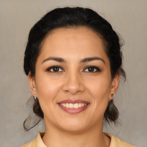 Joyful white young-adult female with medium  brown hair and brown eyes