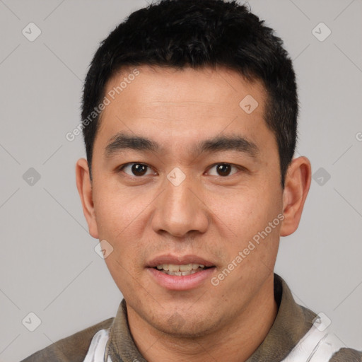 Joyful white young-adult male with short  black hair and brown eyes