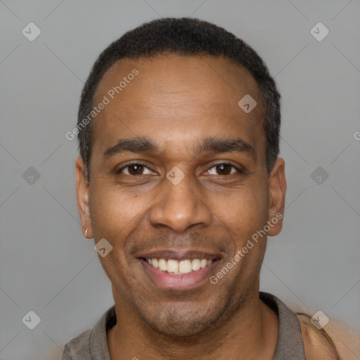 Joyful latino adult male with short  black hair and brown eyes