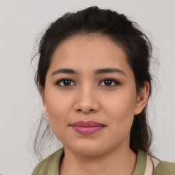 Joyful latino young-adult female with medium  brown hair and brown eyes