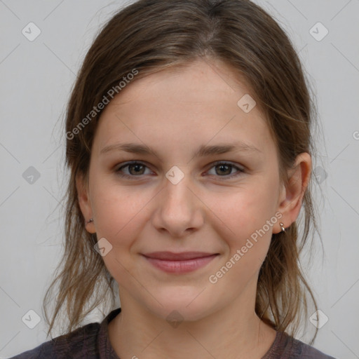 Joyful white young-adult female with medium  brown hair and grey eyes