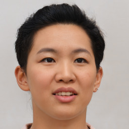 Joyful asian young-adult female with short  brown hair and brown eyes