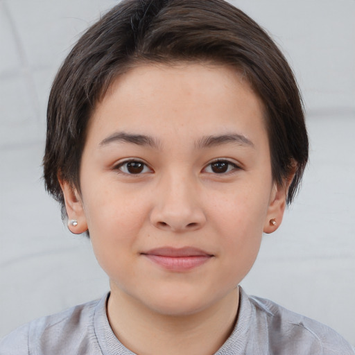 Joyful white child female with short  brown hair and brown eyes