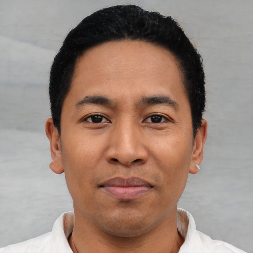 Joyful asian young-adult male with short  black hair and brown eyes