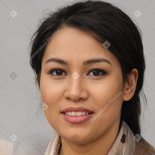 Joyful latino young-adult female with medium  brown hair and brown eyes