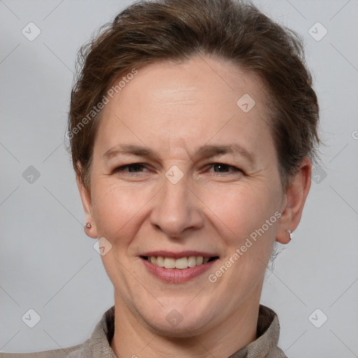 Joyful white adult female with short  brown hair and brown eyes