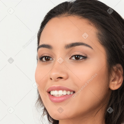 Joyful white young-adult female with long  black hair and brown eyes