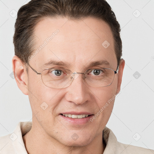 Joyful white adult male with short  brown hair and grey eyes