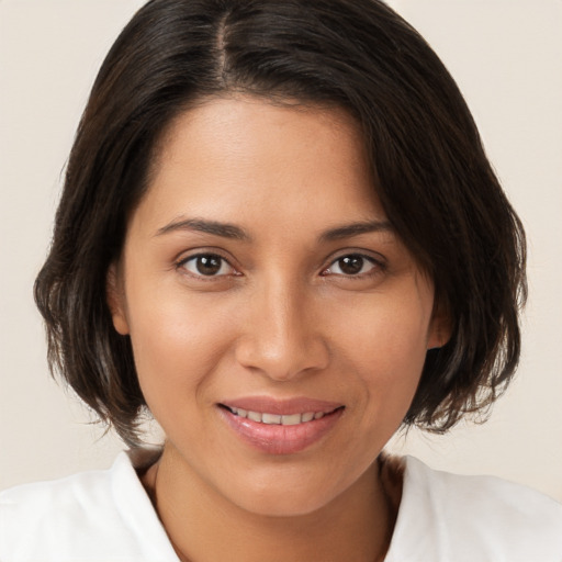 Joyful white young-adult female with medium  brown hair and brown eyes