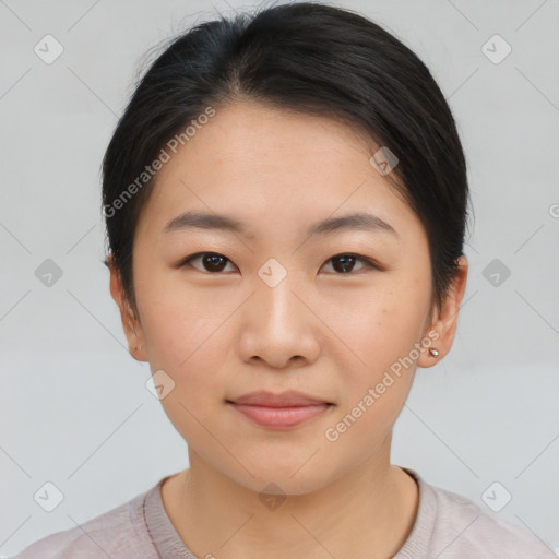 Joyful asian young-adult female with short  brown hair and brown eyes