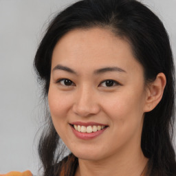 Joyful asian young-adult female with long  brown hair and brown eyes