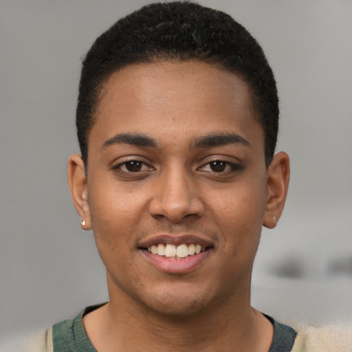 Joyful latino young-adult male with short  brown hair and brown eyes