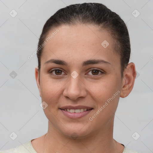 Joyful white young-adult female with short  brown hair and brown eyes