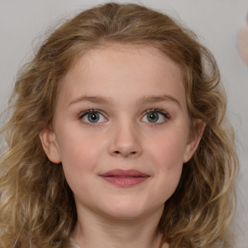 Joyful white child female with medium  brown hair and grey eyes