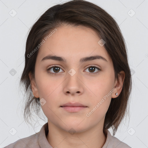 Neutral white young-adult female with medium  brown hair and brown eyes