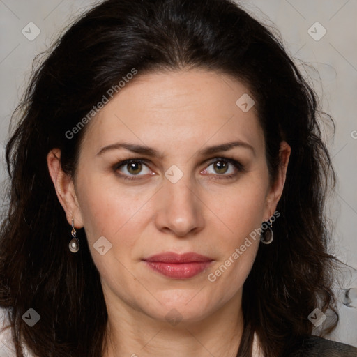 Joyful white adult female with long  brown hair and brown eyes