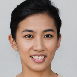 Joyful asian young-adult female with short  brown hair and brown eyes