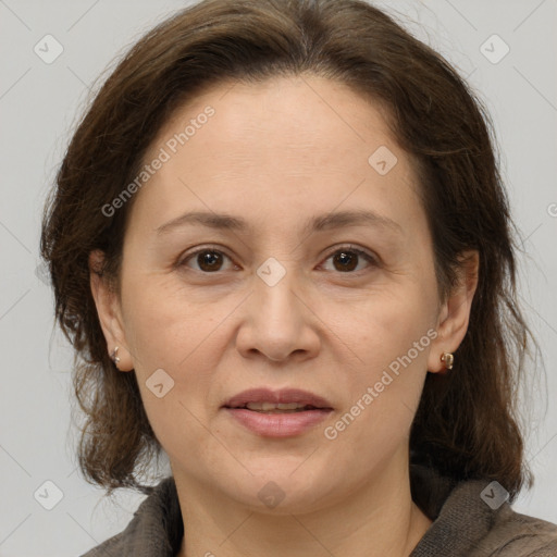 Joyful white adult female with medium  brown hair and brown eyes