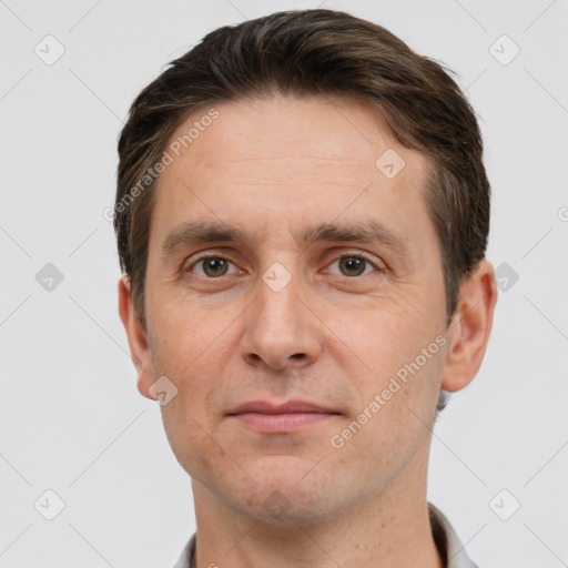 Joyful white adult male with short  brown hair and grey eyes