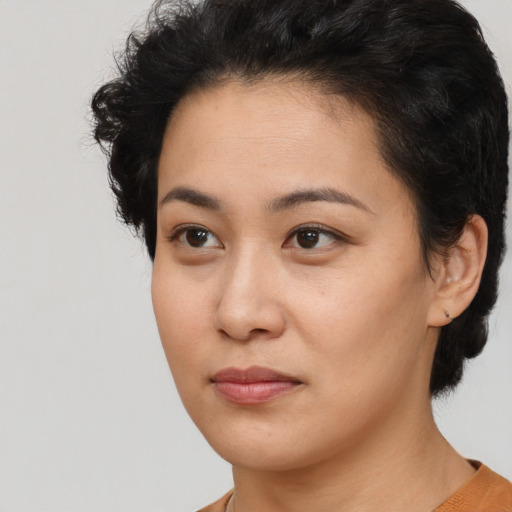 Neutral white young-adult female with short  black hair and brown eyes