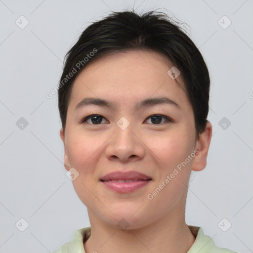 Joyful asian young-adult female with short  brown hair and brown eyes