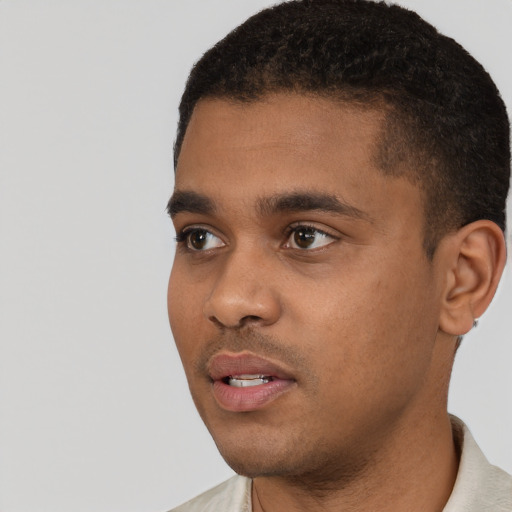 Neutral black young-adult male with short  black hair and brown eyes