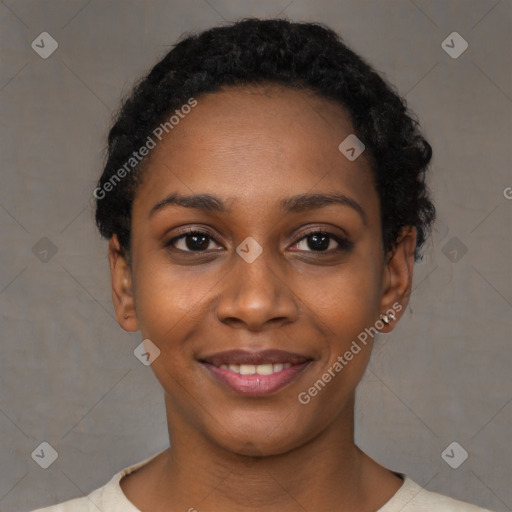 Joyful black young-adult female with short  black hair and brown eyes