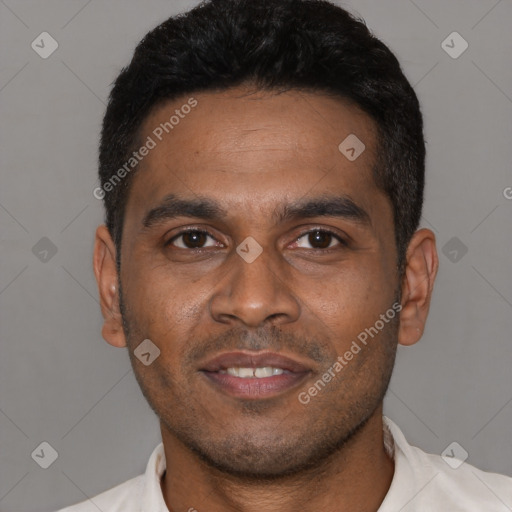Joyful latino young-adult male with short  black hair and brown eyes