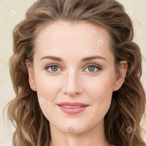 Joyful white young-adult female with long  brown hair and blue eyes