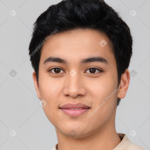 Joyful asian young-adult male with short  black hair and brown eyes