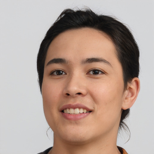 Joyful asian young-adult female with short  black hair and brown eyes