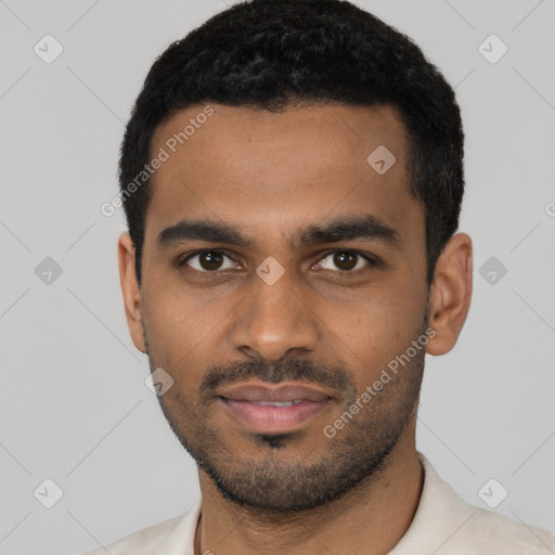 Joyful black young-adult male with short  black hair and brown eyes