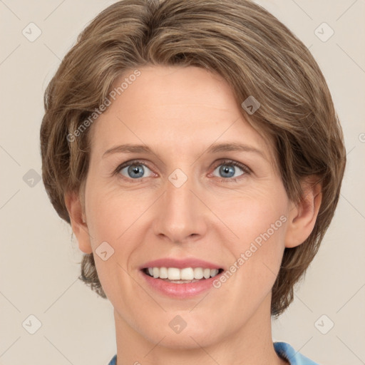 Joyful white young-adult female with medium  brown hair and green eyes