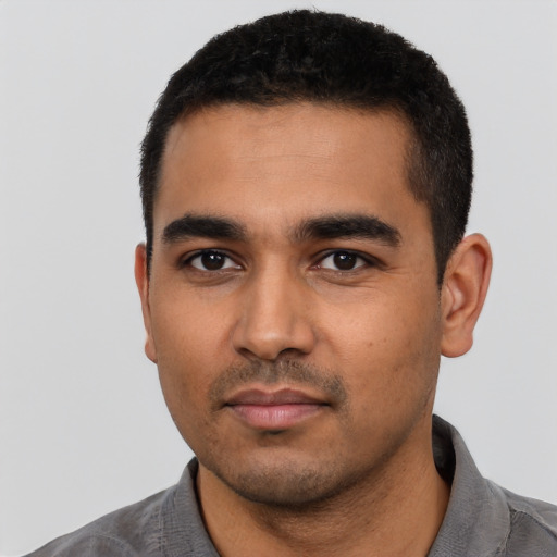 Neutral latino young-adult male with short  black hair and brown eyes