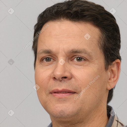 Joyful white adult male with short  brown hair and brown eyes