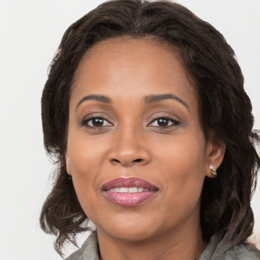 Joyful white adult female with long  brown hair and brown eyes