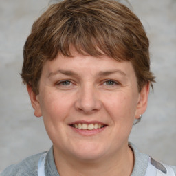 Joyful white young-adult female with short  brown hair and grey eyes