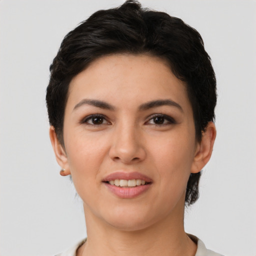 Joyful latino young-adult female with short  brown hair and brown eyes